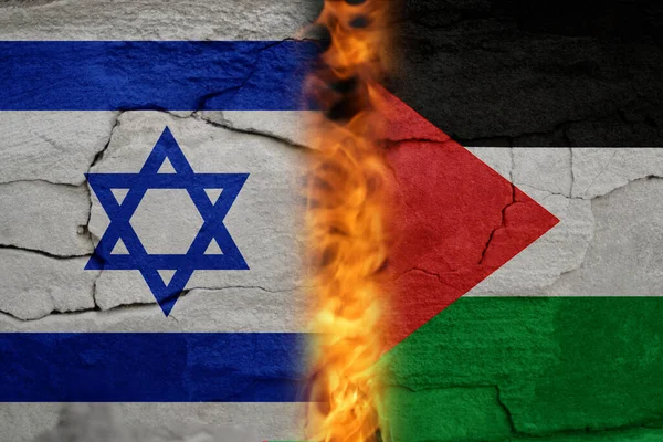 Israel Palestine war. Concept of crisis of war and political conflicts between nations. Flags. Fire, flames. Cracked stone background. Out of focus.