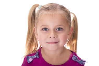 Portrait of a happy smiling child girl on a white background