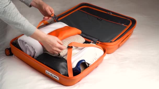 Girl Puts Warm Clothes Suitcase Travel Adventure Concept — Vídeos de Stock