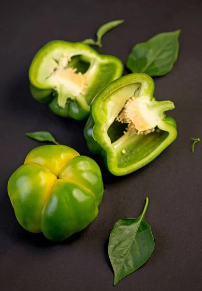 sweet pepper, green bell pepper on black background