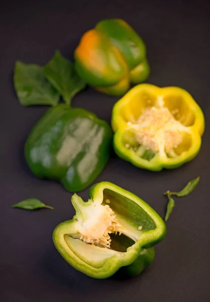 sweet pepper, green bell pepper on black background