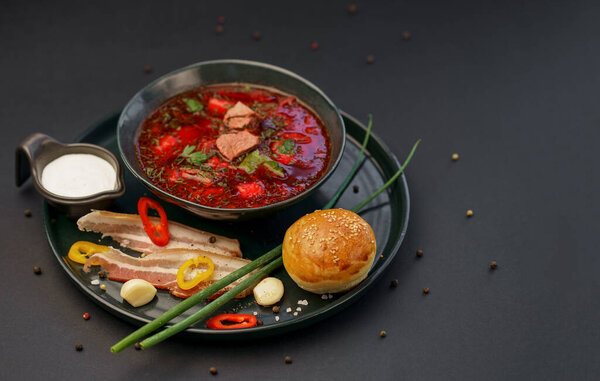 Traditional Ukrainian Russian borscht . Bowl of red beet root soup borsch with white cream . Beet Root delicious soup .