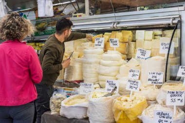 Fethiye, Turkey - April 23, 2023:  Wide section of cheeses for sale at Fethiye Market. clipart