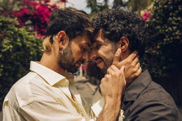 stock image Gay couple in love embracing each other outdoors. Close-up portrait of a gay couple.