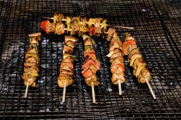 Yummy barbecue have a good meal. Cooking a group of Brochettes on a Barbecue. BBQ with beef and vegetables