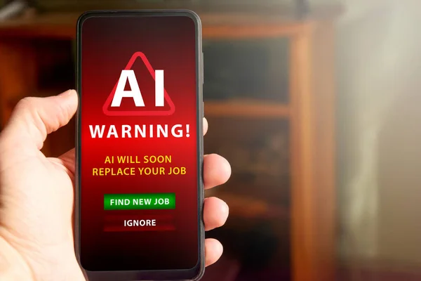 Horizontal shot of male hand holding mobile phone screen with warning about AI replacing the man\'s job soon in the future. Concept of AI replacing jobs, social issue.