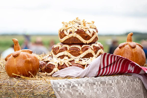 Rural autumn fair. Beautiful yeast pie and pumpkin buns.