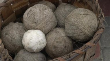 A group of linen threads of rope yarn in a basket.