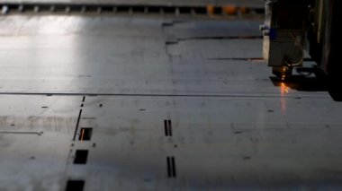Cutting sheet metal parts. CNC laser machine. High precision steel cutting.
