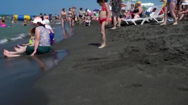 Georgia. Ureki  August 10, 2022 . Magnetic black sand beach. Many people relax on the black sand of the magnetic beach.