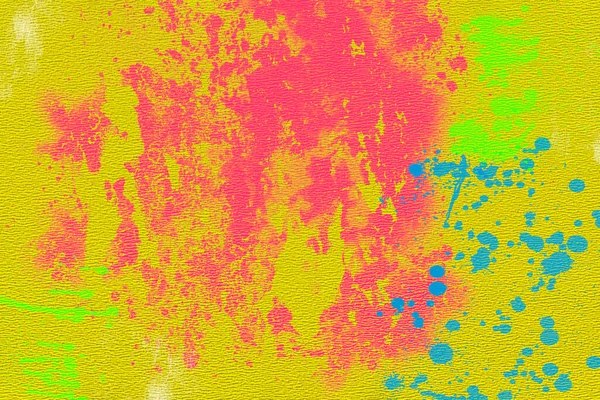 黄色纹理纸上的粉红和蓝色油漆污迹 — 图库照片