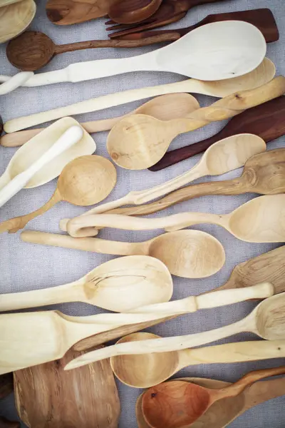 Wooden spoons and spatulas are sold at the fair. Wooden souvenirs.