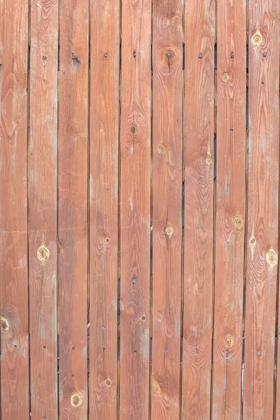 Classic background of wooden boards uneven with nails.