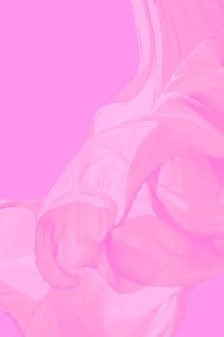 Uçan kumaşla sakin, dikey pembe arkaplan.