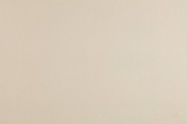 Eşit desenli bej duvar kağıdının arkaplanı. Bej kaplama duvar.