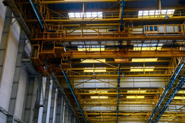 The overhead crane and scaffolding. at an aircraft factory. The aircraft production.
