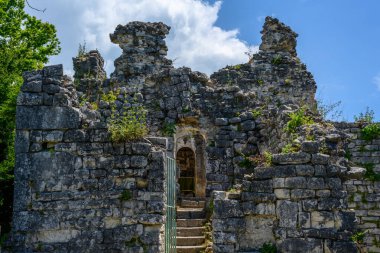 New Athos, Abkhazia, Georgia - July 04, 2022: Ruins of Anacopia Fortress at the top of the Iverian Mountain in New Athos, Abkhazia. clipart