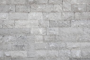 Gri tuğla duvarın dokusu.