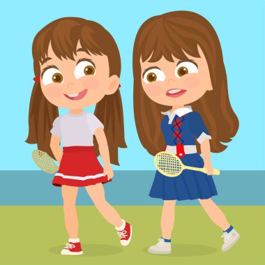 İki kız tenis oynuyor.