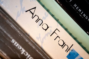 Alghero, ITA - Feb 27, 2016: Macro view of The Diary of Anne Frank in a bookshelf clipart