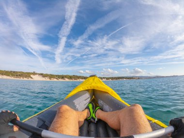 Kayaking in Sardinia on a cloudy day in autumn, Italy clipart