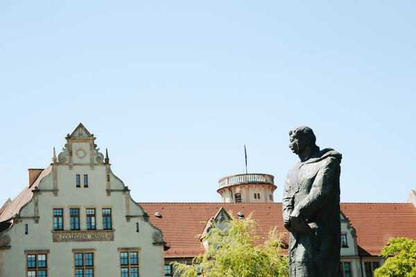 Poznan, Poland - June 9, 2019 : Adam Mickiewicz University and monument