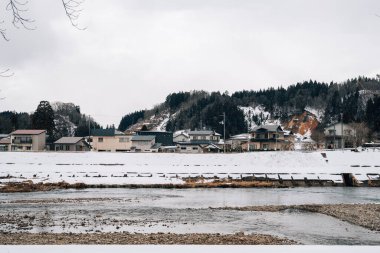 Kakunodate town and Hinokinai River at winter in Akita, Japan clipart