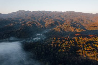 Mist and morning light in a rural village in the mountains