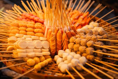 Skewers of streetfood on a table in Thailand