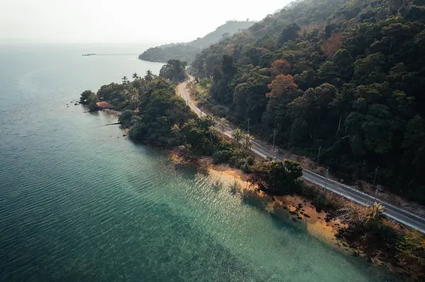 Seaside road approaching a beach seen from above koh Chang