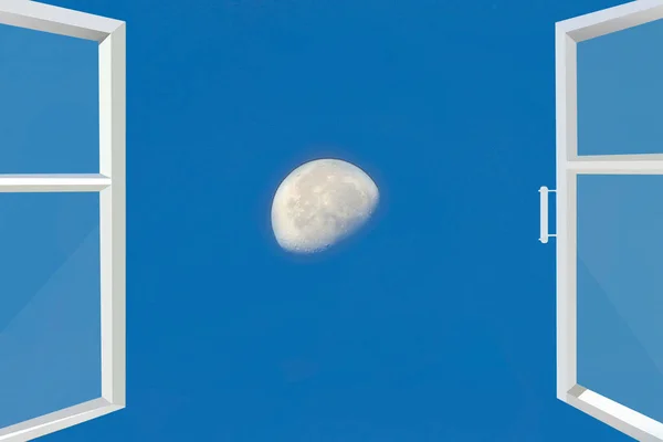 View of moon through open window. Sky panorama. View of moon in blue sky. Panorama with moon and sky from opened window of room. Lunar landscape from bedroom window. Celestial landscape. Room window