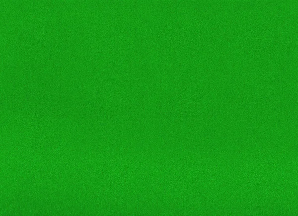 Green textured background. Pattern of greenish background. abstract green texture. Uniform green background. Grainy green color texture