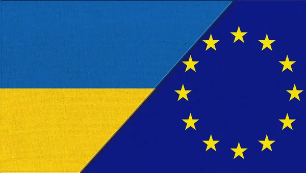 Ukraine and EU flags. Flag of Ukraine and European union. European union flag. EU flag. Yellow stars on blue background of European flag. Ukrainian and European flag on fabric surface