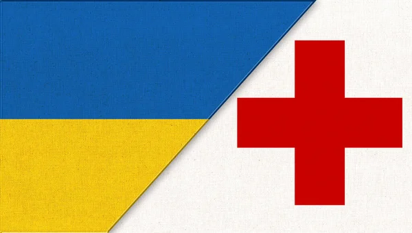Ukraine and Red Cross flags. Flag of Ukraine and Red Cross. Red Cross flag. ICRC flag. Ukrainian and Red Cross flags on fabric surface. International Committee of the Red Cross