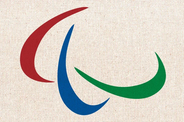 International Paralympic Committee flag. IPC flag. International Paralympic Committee flag on fabric surface
