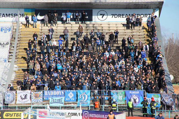 Chernihiv-Ukraine. 14 March 2020: Football match between FC Desna Chernihiv and FC Dynamo Kyiv. Soccer in Ukraine. Football fans of Dynamo Kyiv support team during match and burn fires. Football hooligans on the tribune
