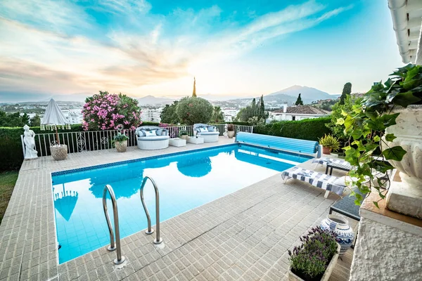 a poolside image from a luxury chalet overlooking the Costa Del Sol 