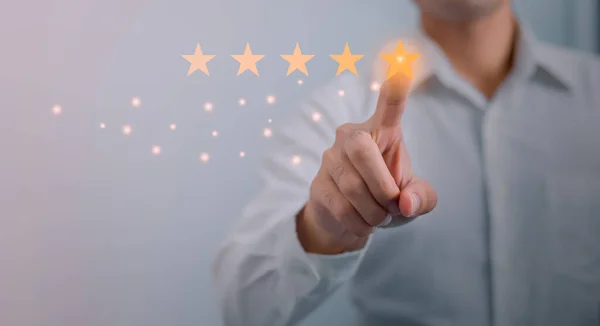 stock image Customer service and Satisfaction concept ,Business people are touching the virtual screen on the happy Smiley face icon to give satisfaction in service. rating very impressed.