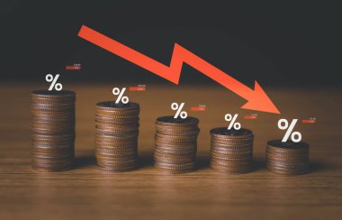 interest rates and dividends, investment returns, income, retirement Compensation fund, investment, dividend tax. pile of coins and upward direction percentage symbol. saving money for investment
