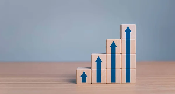 stock image business growth success process concept. wood block stacking as step stair with arrow up. plan growth and increase of positive indicators in his business.