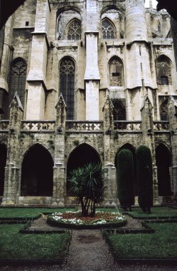 Narbonne, Occitanie, France: cloister of the medieval cathedral clipart