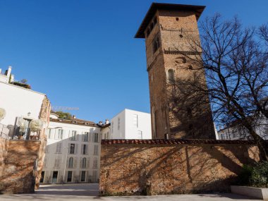 Piazza Tomasi di Lampedusa, historic square of Milan, Lombardy, Italy, with ruins of the Roman Imperial Palace and the Gorani house with its tower clipart