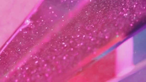 バックグラウンドを明るく グリッターサンド トレンディな抽象的魅惑的な催眠術に広がるボケのライトが付いている明るいピンクの光の流動的なペンキの波 — ストック動画