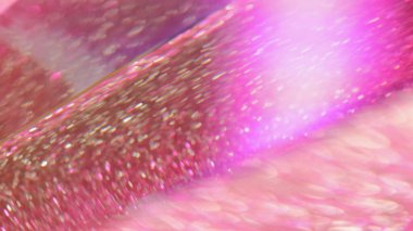 Işıldayan arka plan. Parlak kum. Bokeh 'in odaksız ışığıyla parlak pembe bir parıltı. Soyut büyüleyici hipnotik sanat.