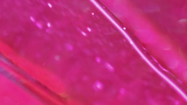 闪光的流体背景 闪烁着浪花闪闪发光的凝胶 抽象催眠艺术中明亮的粉色光泽液体涂料流在光滑纹理中的扩散 — 图库视频影像