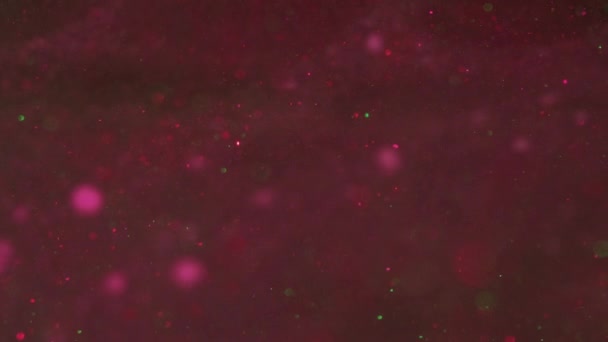 ボッケーライト 割り当てられた光 レンズフレア 催眠抽象芸術における液体カラフルな赤紫色物質の背景に広がる光沢のある丸い粒子 — ストック動画