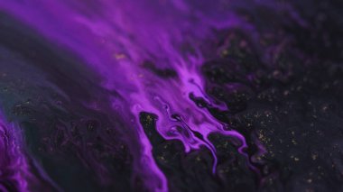 Boya damlası. Mürekkep akışı. Odaklanamayan parlak neon rengi siyah altın rengi akışkan dalga parçacıkları deseni karanlık sanat soyut arkaplan.