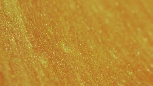 Wet Glitter Flow Paint Spill Shimmering Golden Color Metallic Particles — Stock Video