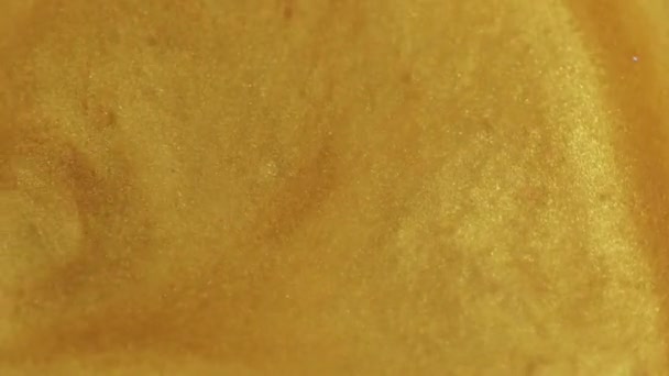 抽象的な背景 薄暗くなるペイントモーション グリッター ウェーブ モルトゴールド 幻想的なトレンディな芸術に広がる光沢のある黄色い穀物質の渦 — ストック動画