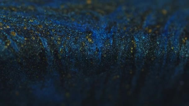 Sparkling Ink Spill Paint Drip Glitter Cascade Defocused Blue Black — Stock Video